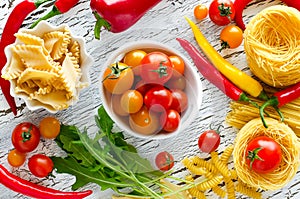 Ingredients for cooking pasta and vegetables red yellow green