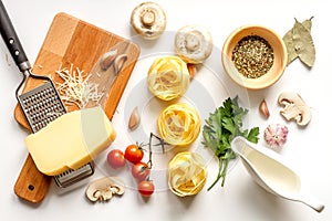 Ingredients for cooking paste on white background top view