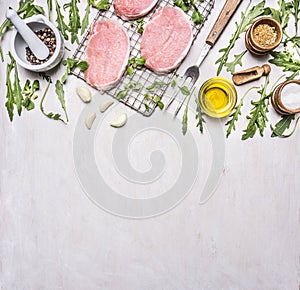 Ingredients for cooking pork with herbs and pepper border ,place for text wooden rustic background top view