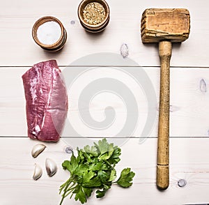 Ingredients for cooking pork steak with herbs and spices lined frame place for text wooden rustic background top view