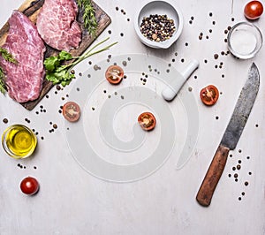 Ingredients for cooking Pork steak with vegetables and spices on wooden rustic background top view close up place text,frame