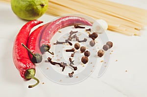 Ingredients for cooking spaghetti/Ingredients for cooking spaghetti on a white marble background