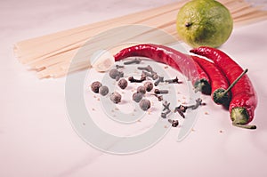 Ingredients for cooking spaghetti/Ingredients for cooking spaghetti on a white marble background. Toned