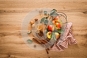 Ingredients for cooking Thanksgiving autumn apple pie with fresh fruits, cinnamon and walnuts on wooden table