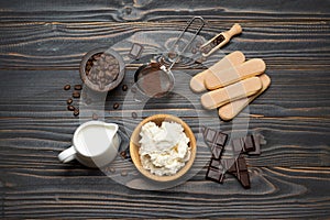 Ingredients for cooking tiramisu - Savoiardi biscuit cookies, mascarpone, cream, sugar, cocoa, coffee and egg