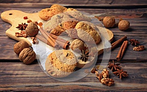 Homemade pastries with spices, nuts and raisins on a wooden table. Close-up. Christmas. A fragrant gift of handmade. Traditions.