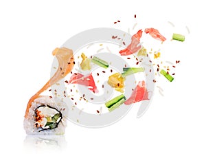 The ingredients fly out of the unfolded sushi roll