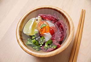 Ingredients for Fo Bo soup in a bamboo bowl