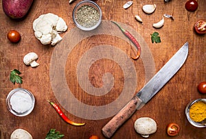 Ingredients for food spice cauliflower salt and garlic herbs knife frame with space text rustiÃÂ wooden background top view