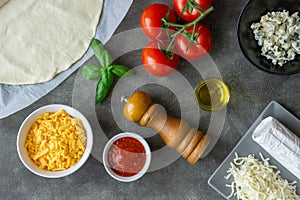 Ingredients for four cheese pizza on the table. Vegetarian food.