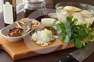 Ingredients for fried or boiled potato with mushrooms and onion