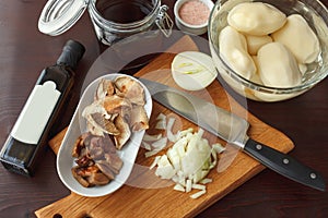 Ingredients for fried or boiled potato with mushrooms and onion