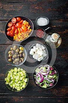 Ingredients for greek salad, on old dark  wooden table background, top view flat lay