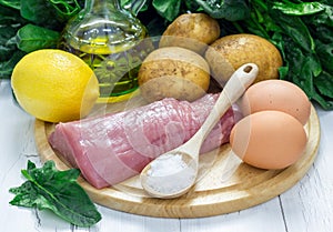 Ingredients for green soup with spinach meat, potato and egg (green borscht)