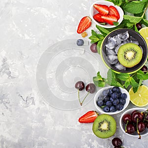 Ingredients healthy diet family meals: fresh juicy fruits and berries with mint and ice to prepare a healthy summer