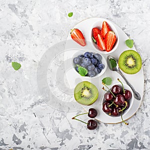 Ingredients healthy diet family meals: fresh juicy fruits and berries with mint and ice to prepare a healthy summer