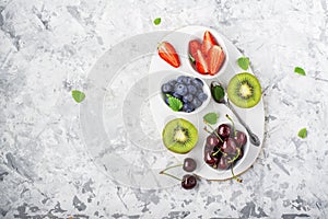 Ingredients healthy diet family meals: fresh juicy fruits and berries with mint and ice to prepare a healthy summer