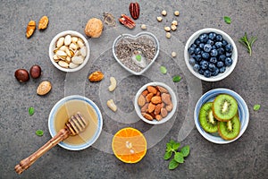 Ingredients for a healthy foods background, nuts, honey, berries