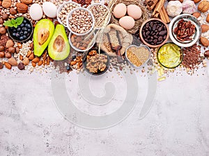 Ingredients for the healthy foods selection. The concept of superfoods set up on white shabby concrete background with copy space