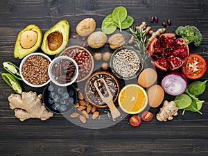 Ingredients for the healthy foods selection on dark background. Balanced healthy ingredients of unsaturated fats and fiber for the