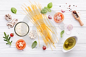 Ingredients for homemade pasta on wooden background