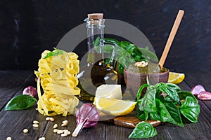 Ingredients for homemade pesto: basil, parmesan, pine nuts, garlic, olive oil