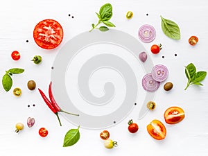 The ingredients for homemade pizza on white wooden background