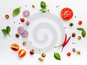 The ingredients for homemade pizza on white wooden background