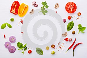 The ingredients for homemade pizza on white wooden background