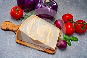 Ingredients for Italian dish made from fresh eggplant, parmesan cheese and tomatoes Melanzane alla parmigiana