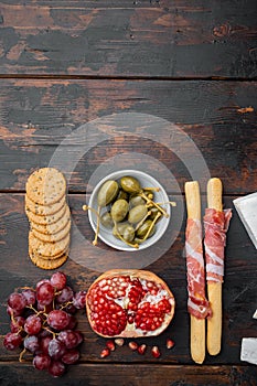 Ingredients for Italian  food, meat cheede, herbs, on dark wooden background, top view  with copy space for text
