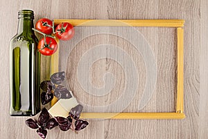 Ingredients Italian pasta on beige board with empty copy space as decorative frame background.