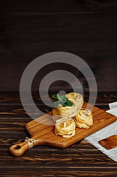 Ingredients for Italian Pasta on wooden table. Picture with free space for text.