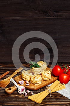 Ingredients for Italian Pasta on wooden table. Picture with free space for text.