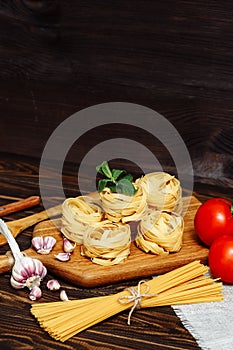 Ingredients for Italian Pasta on wooden table. Picture with free space for text