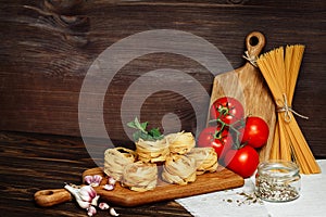 Ingredients for Italian Pasta on wooden table. Picture with free space for text