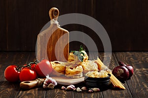 Ingredients for Italian Pasta on wooden table. Picture with free space for text