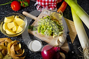 ingredients in a kitchen to make a tasty recipe for mashed leek and potato with cream