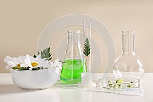 Ingredients and laboratory glassware on table.