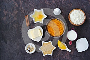 Ingredients for making American pumpkin pie. Thanksgiving dessert recipe. Top view