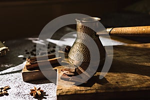 Ingredients for making coffee, cinnamon, chocolate, spices on a brown wooden board 3