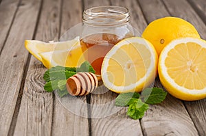 Ingredients for making lemonade - lemon, mint and honey