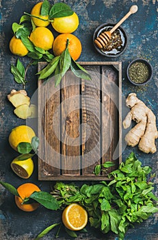 Ingredients for making natural drink with wooden tray in center