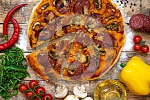 Ingredients for making pizza baked on a wooden table, top view, step-by-step recipe