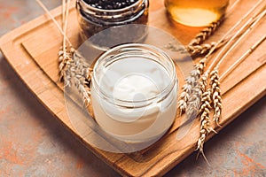Ingredients for making tasty and healthy dessert with greek yogurt, berries and honey