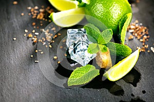 Ingredients of Mojito. Lime, mint, ice cubes and brown sugar