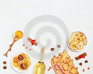 Ingredients for mulled wine, christmas holiday hot winter drink, white wine, dried fruits, gingerbread cookies