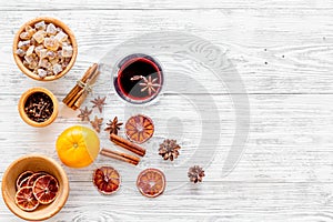 Ingredients mulled wine or grog with spices and citrus for winter evening. Christmas new year eve. Wooden background top