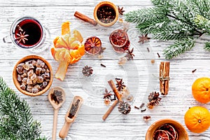 Ingredients mulled wine or grog with spices and citrus for winter evening. Christmas new year eve. Wooden background top