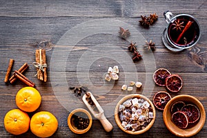 Ingredients mulled wine or grog with spices and citrus for winter evening. Christmas new year eve. Wooden background top